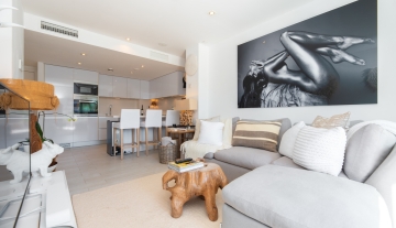 Resa Estates apartment for sale in Ibiza marina botafoch modern living room and kitchen.jpg